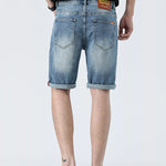 Lifestyle Image of Trendbye Men's Rolled Hem Denim Shorts
