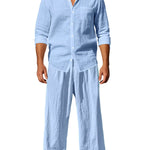 Trendbye Man wearing a light blue linen shirt and pants on a white background