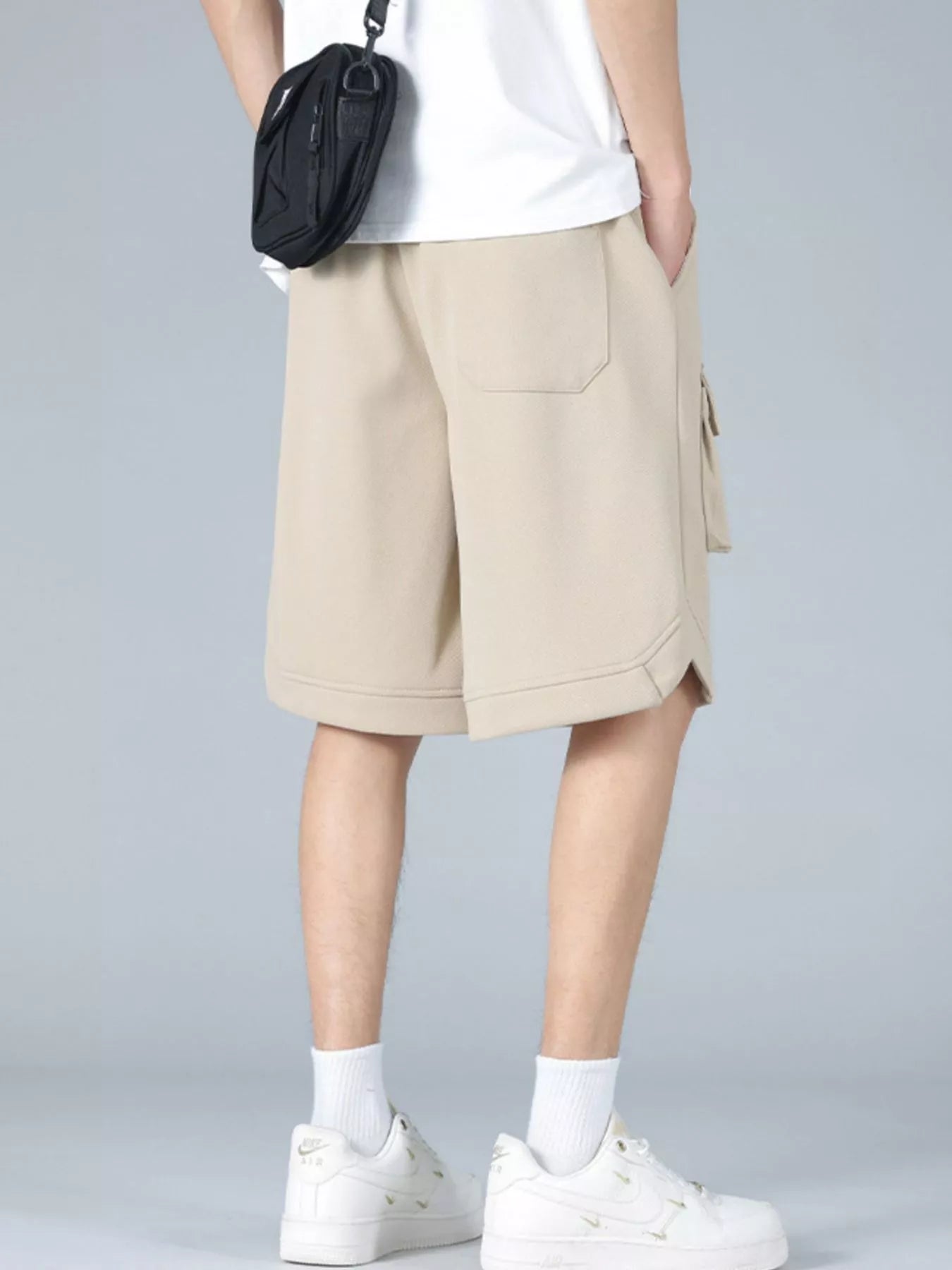 Trendbye Men's wearing beige white shorts