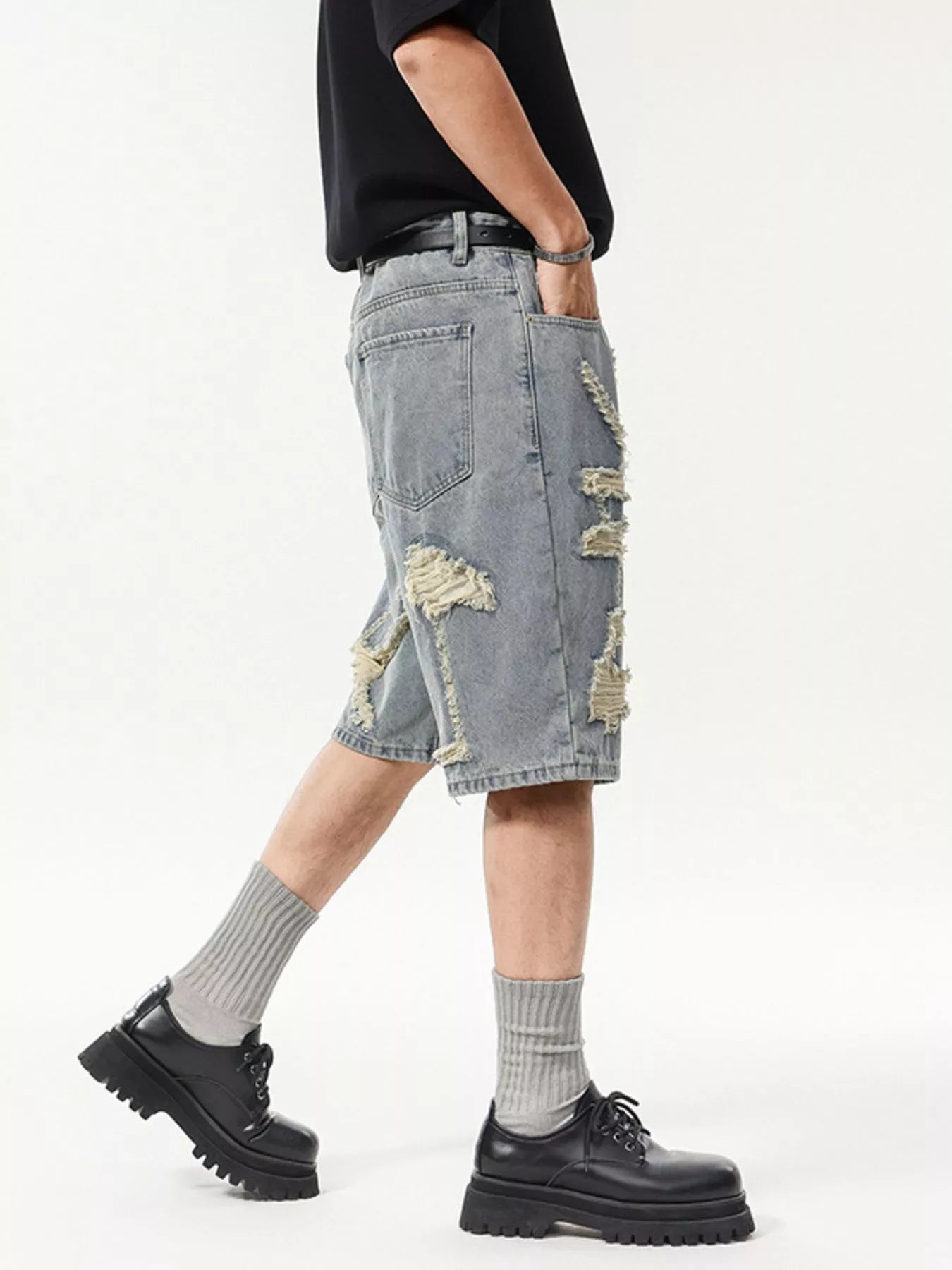 Trendbye Men's wearing distressed denim shorts
