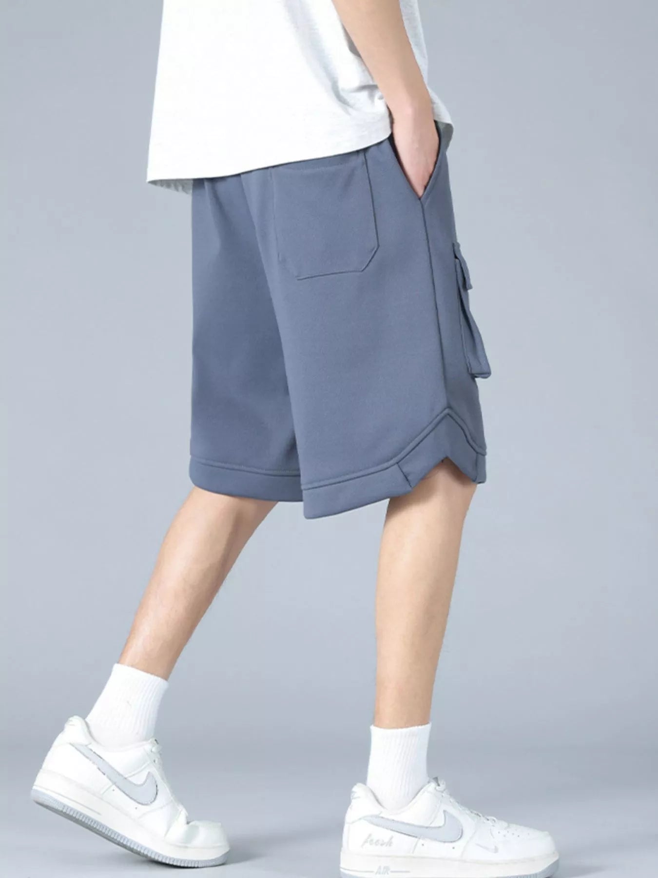Trendbye Men's wearing gray shorts