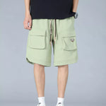 Trendbye Men's wearing light green cargo shorts 