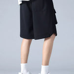 Trendbye men's wearing a black skirt shorts