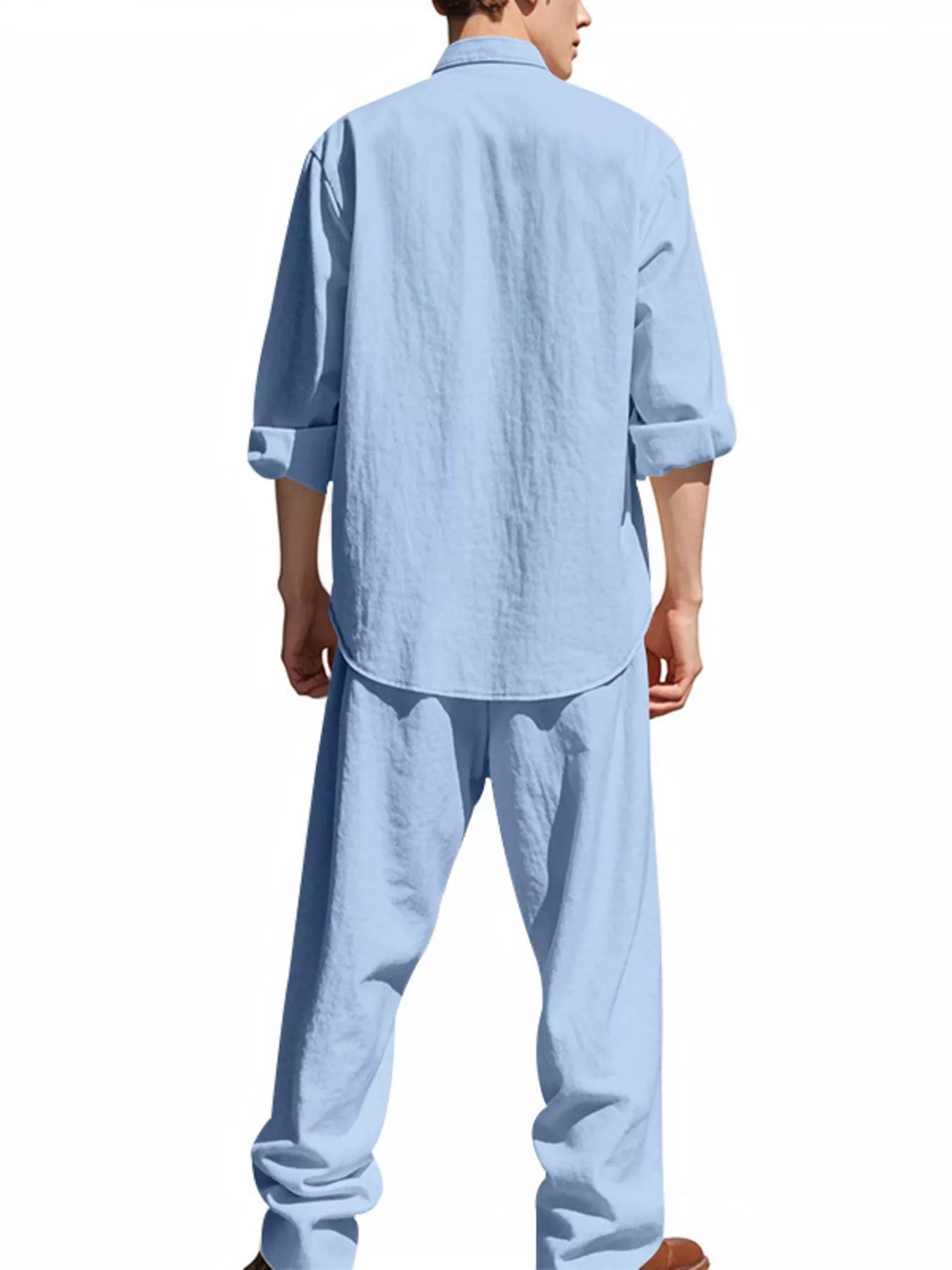Trendbye wearing a light blue shirt and pants set